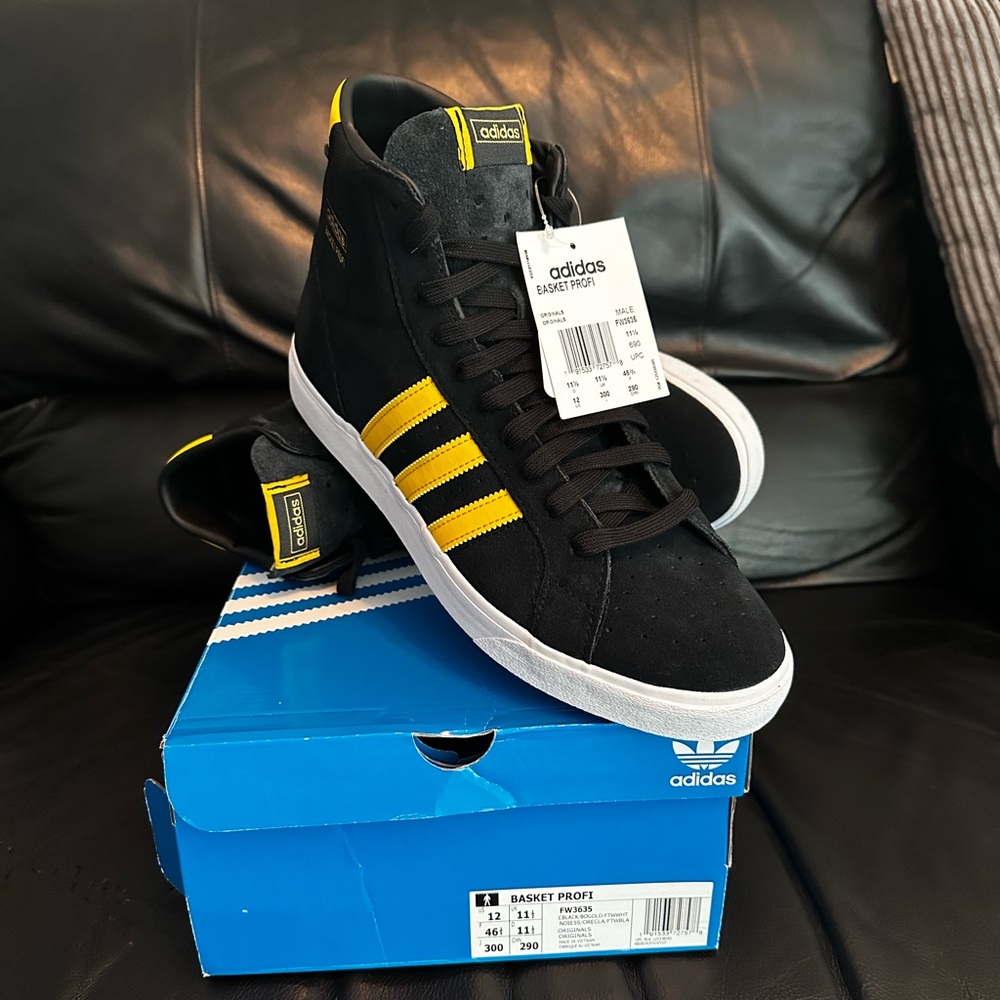 Black with yellow stripes, size 12, Adidas Originals Suede High Top Sneakers.